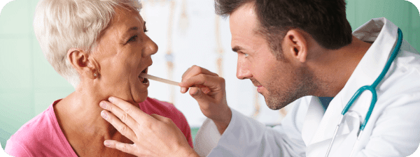 Checking the mouth and throat to detect cancer.