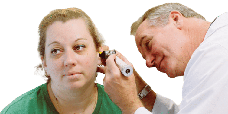 A mature woman being checked by audiologist to detect hearing problems.