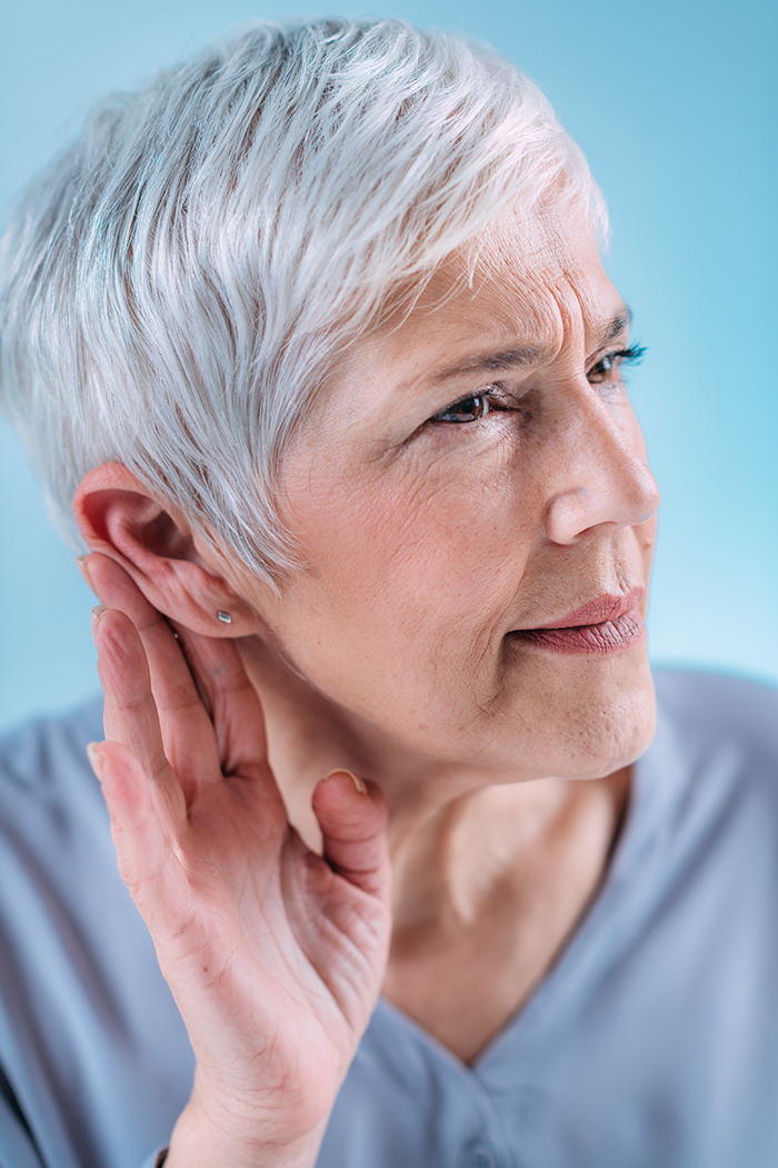 Senior woman in need of hearing restoration treatment